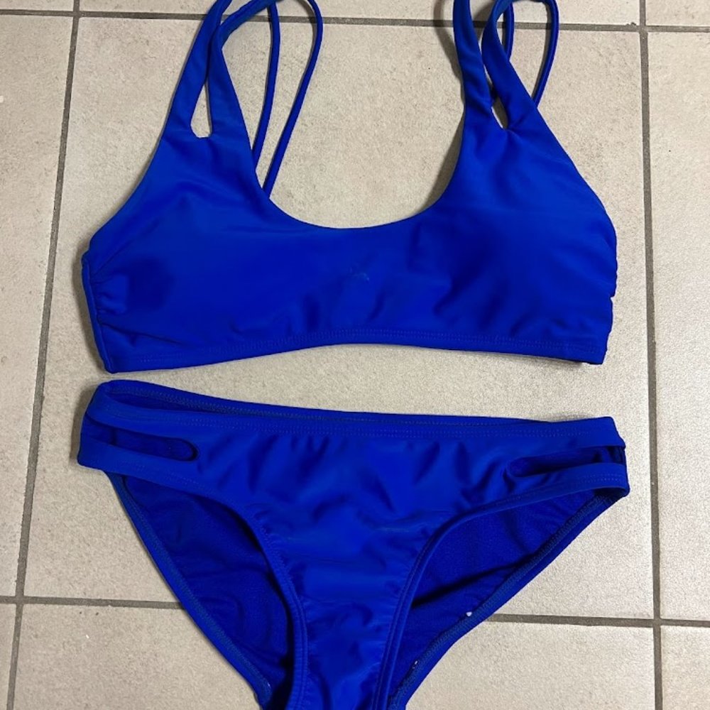 Blue strappy bikini with cutouts on the bottoms